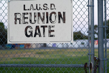 School sign on fence