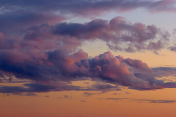 dramatic textured clouds at sunset yellow red tones