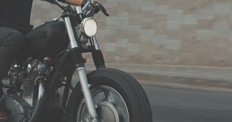 Biker riding on motorcycle in city