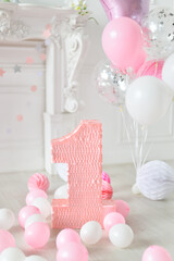 One year birthday decorations. A lot of balloons pink and white colors. 