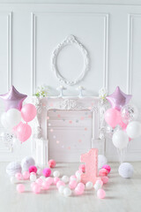 One year birthday decorations. A lot of balloons pink and white colors. 