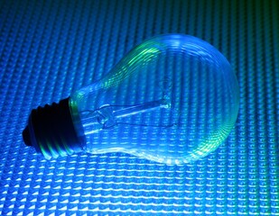 blue and green light bulb with textured background