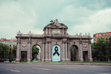 Fototapeta na wymiar Madrid, Spain - May 25, 2020:The Alcala Door (Puerta de Alcala) is a one of the ancient doors of the city of Madrid Spain. It was the entrance of the people coming from France, Aragon, and Catalunia.