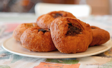 Close-up of Tatar deep-fried patties belyashi with meat and onions. 