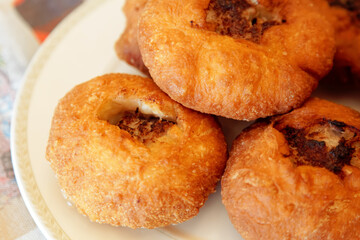 Close-up of Tatar deep-fried patties belyashi with meat and onions. 