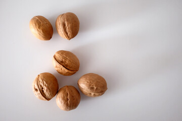 Walnuts spilled on a white table