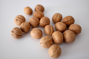 Walnuts spilled on a white table