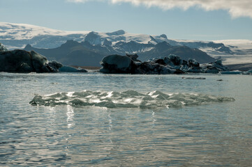 glittery small iceberg at glacier lagoon