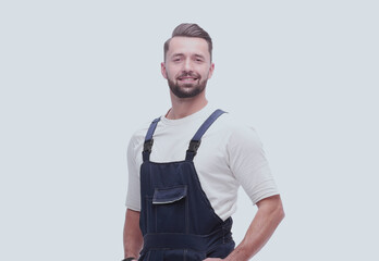 side view. smiling man in overalls looking forward to copy space
