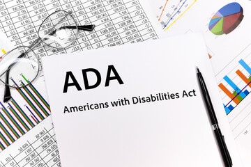 ADA Americans with Disabilities Act Concept. the inscription on the sheet. pen, glasses, documents,...