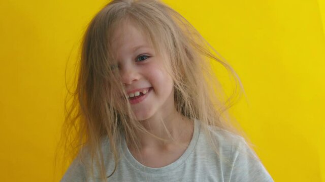 Little blonde girl over isolated background surprised with hand on head for mistake, remember error. Forgot, bad memory concept. High quality 4к footage