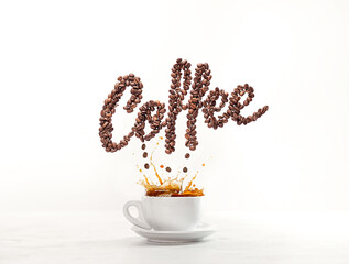 Coffe splash from cup with cookies and coffee beans spelling the word Coffee