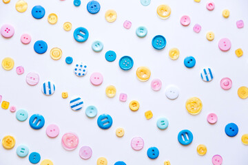 Flat lay with colorful sewing buttons, mock up, top view.