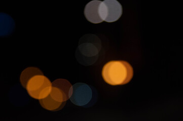 Background lights in defocus of different colors.