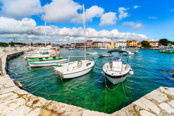 Fototapeta na wymiar Marina and Campanile of the picturesque Fazana on Istria peninsula in Croatia