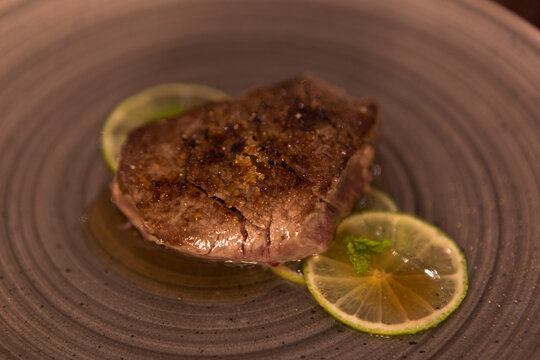 Lime Fillet Gourmet Recipe Resting On A Restaurant Table, No People Are Visible.