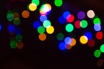 Background lights in defocus of different colors.