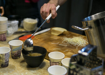 French onion soup is being prepared for serving