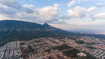 Amazing city landscape and a volcano in the background