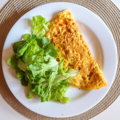 Omelet with lettuce salad 