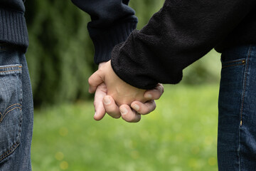 Closeup of Couple in Love Holding Hands