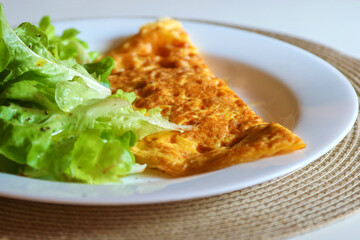 Omelet with lettuce salad 