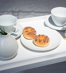 Breakfast in bed. Tea with donuts and good mood.