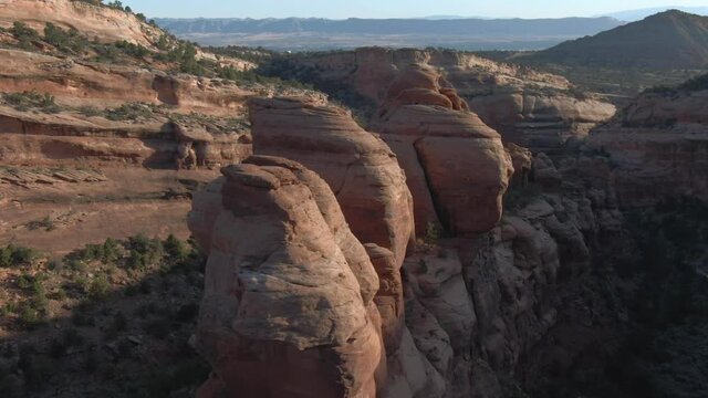 early morning drone flight over red rock formations bang canyon near grand junction colorado