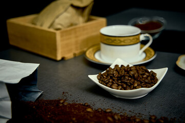 Preparation of a delicious Colombian café traditionally filtered with fabric. On the table implements necessary for its preparation and how to serve it.