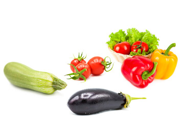 Ripe fresh organic vegetables in drops of dew isolated on a white background. Tomatoes, zucchini,...