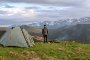 Fototapeta premium hiker with equipment spends time hiking in the mountains