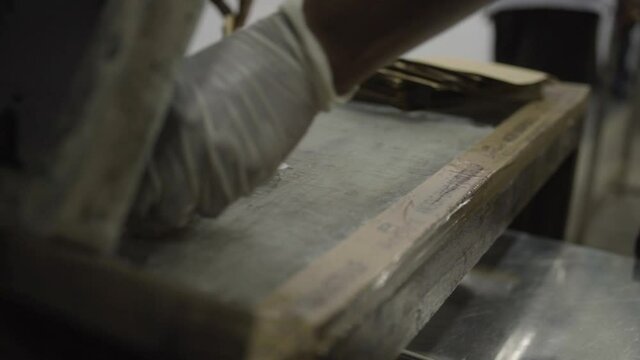 Close up on screen printing packaging label in factory in India