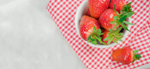 Fresh strawberries. Strawberry Background. Macro texture. big, big strawberries. On a light background. Picking clean local strawberries. View from above. Banner. Copyspace