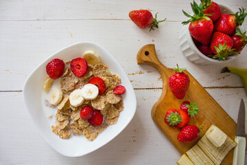 Oatmeal with strawberries and banana. Healthy breakfast. Oatmeal on top. Fresh healthy breakfast. Healthy food
