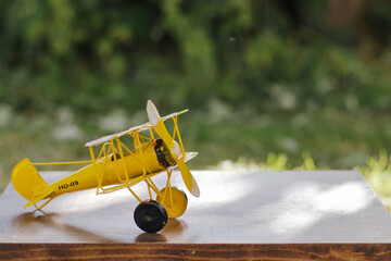 yellow metal plane © Small