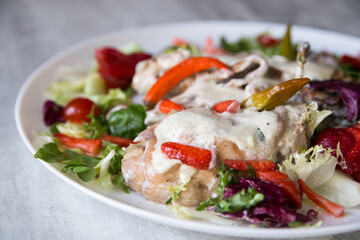 rabbit stewed in a creamy sauce served with vegetables and strawberries