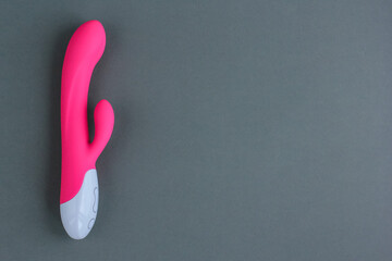 Sex toy for adult, design pink dildo vibrator isolated on gray background. Concept of sex,...
