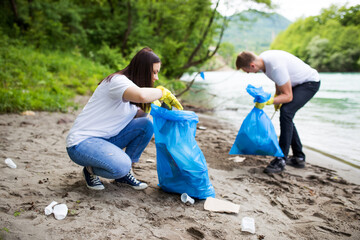 Volunteers clean the beach of plastic waste