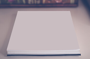 Business composition of photo albums with a notebook on the table