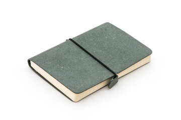 Green diary notebook with elastic band on the white background.
