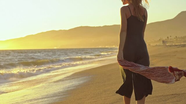  rest relax lies wallow sunbathe  dress skirt sundress tunic tights scarf shawl slow motion medium shot female woman girl lady sunrise sunset evening morning summer sunny dry handheld shot 