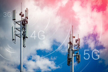 Two telecommunication towers with 4G, 5G transmitters. Cellular base stations with transmitting...
