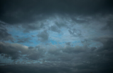 Naklejka na ściany i meble Overcast dark clouds with sky.The gray cloud before rain come.