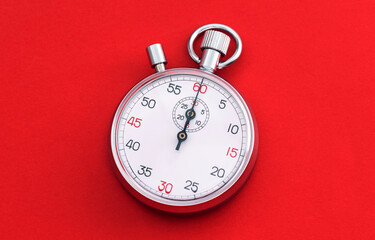 Plakat Analogue metal stopwatch on the blue background.