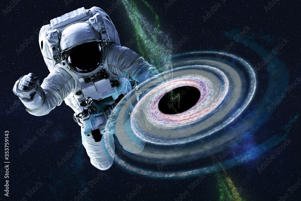 Wall mural astronaut near colourful black hole somewhere in space. dramatic space background. science fiction. 