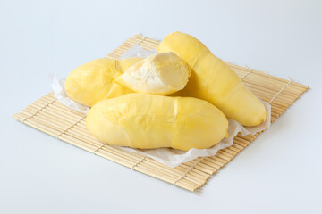 Fresh durian (Monthong) fruit with delicious golden yellow on white background. King of fruit from Thailand on summer season.