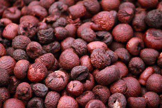 close up of red and black nuts