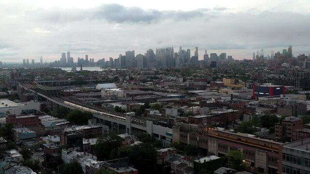 aerial toward Manhattan skyline at day in Brooklyn NYC