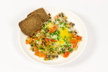 Scrambled Eggs with cooked clamps, vegetables, onions and cherry tomato