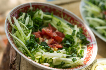 green salad with arugula and tomatoes